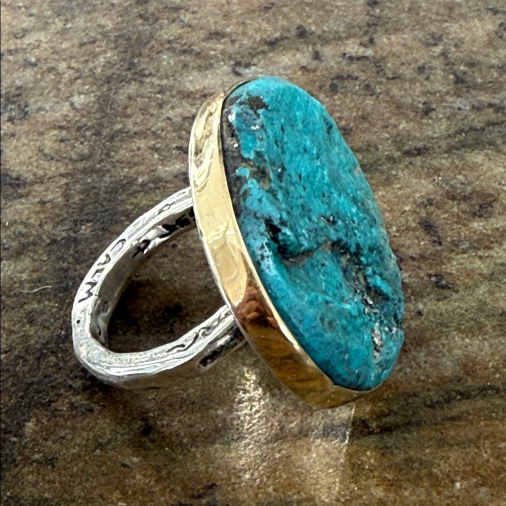 Jes MaHarry one of a kind ring with a rough, unpolished turquoise in gold bezel.